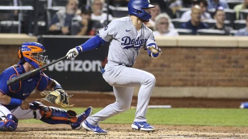 Aug 30, 2022; New York City, New York, USA; Los Angeles Dodgers second baseman Gavin Lux (9) hits a two-RBI double in the third inning against the New York Mets at Citi Field. Mandatory Credit: Wendell Cruz-USA TODAY Sports