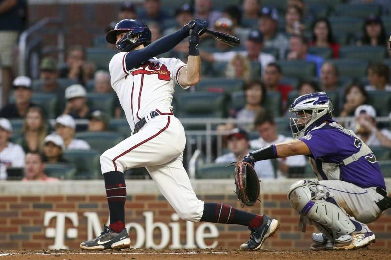 Aug 30, 2022; Atlanta, Georgia, USA; Atlanta Braves shortstop Dansby Swanson (7) hits an RBI double against the Colorado Rockies in the second inning at Truist Park. Mandatory Credit: Brett Davis-USA TODAY Sports