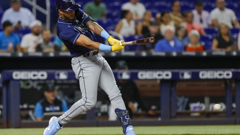 Aug 30, 2022; Miami, Florida, USA; Tampa Bay Rays center fielder Jose Siri (22) hits a single during the fifth inning against the Miami Marlins at loanDepot Park. Mandatory Credit: Sam Navarro-USA TODAY Sports