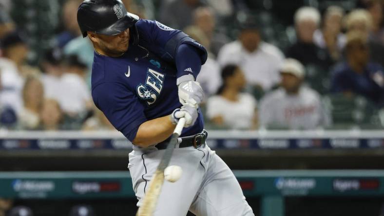 Aug 30, 2022; Detroit, Michigan, USA; Seattle Mariners first baseman Ty France (23) hits a single in the fifth inning against the Detroit Tigers at Comerica Park. Mandatory Credit: Rick Osentoski-USA TODAY Sports