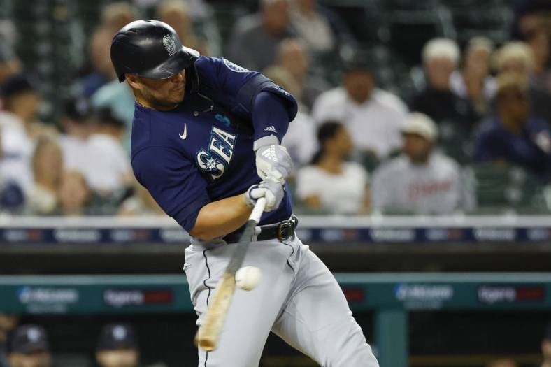 Aug 30, 2022; Detroit, Michigan, USA; Seattle Mariners first baseman Ty France (23) hits a single in the fifth inning against the Detroit Tigers at Comerica Park. Mandatory Credit: Rick Osentoski-USA TODAY Sports