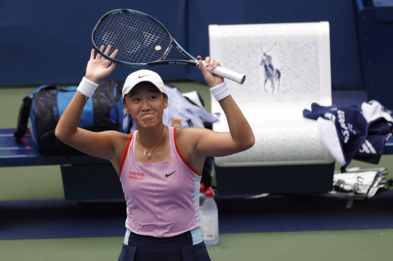 Aug 31, 2022; Flushing, NY, USA; Xiyu Wang (CHN) waves to the crowd after her match against Maria Sakkari (GRE) (not pictured) on day three of the 2022 U.S. Open tennis tournament at USTA Billie Jean King Tennis Center. Mandatory Credit: Geoff Burke-USA TODAY Sports