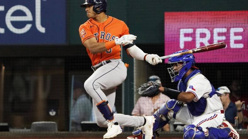 Aug 31, 2022; Arlington, Texas, USA; Houston Astros shortstop Jeremy Pena (3) follows thru on a single during the fourth inning against the Texas Rangers at Globe Life Field. Mandatory Credit: Raymond Carlin III-USA TODAY Sports