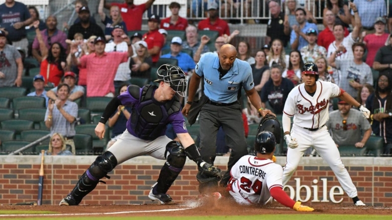 Aug 31, 2022; Cumberland, Georgia, USA; Atlanta Braves catcher William Contreras (24) gets thrown at home in the first inning against the Colorado Rockies at Truist Park. Mandatory Credit: Larry Robinson-USA TODAY Sports