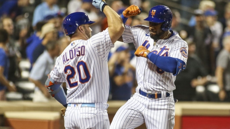 Aug 31, 2022; New York City, New York, USA; New York Mets right fielder Starling Marte (right) celebrates with first baseman Pete Alonso (20) after hitting a two-run home run in the third inning against the Los Angeles Dodgers at Citi Field. Mandatory Credit: Wendell Cruz-USA TODAY Sports
