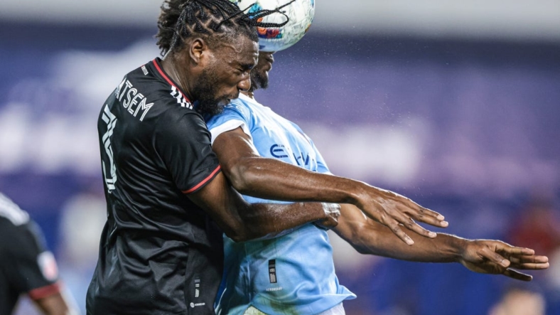 Aug 31, 2022; Harrison, New Jersey, USA; D.C. United defender Chris Odoi-Atsem (3) battles for a high ball against New York City FC forward Talles Magno (43) during the first half at Red Bull Arena. Mandatory Credit: Vincent Carchietta-USA TODAY Sports