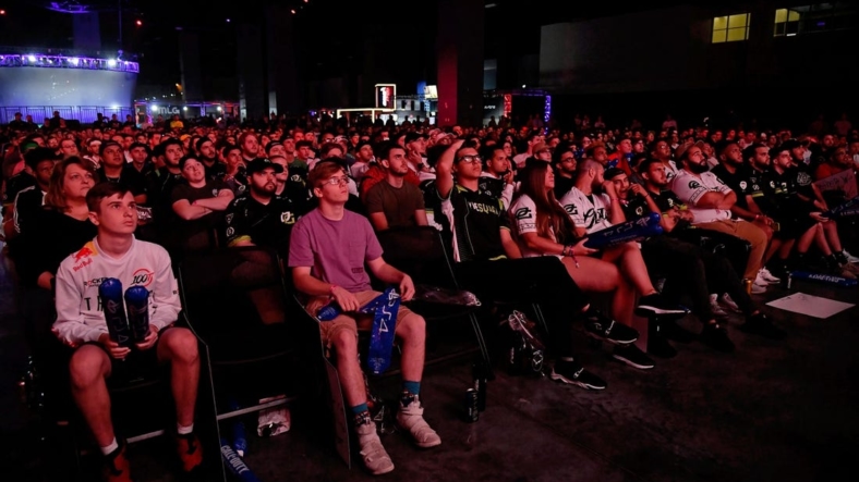 Jul 20, 2019; Miami Beach, FL, USA; Fans in attendance watch the game play between Faze Clan and 100 Thieves during the Call of Duty League Finals e-sports event at Miami Beach Convention Center. Mandatory Credit: Jasen Vinlove-USA TODAY Sports