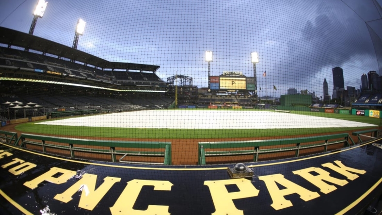 Sep 2, 2020; Pittsburgh, Pennsylvania, USA;  A rain trap covers the field as inclement weather delays the start of the game between the Chicago Cubs and the Pittsburgh Pirates at PNC Park. Mandatory Credit: Charles LeClaire-USA TODAY Sports