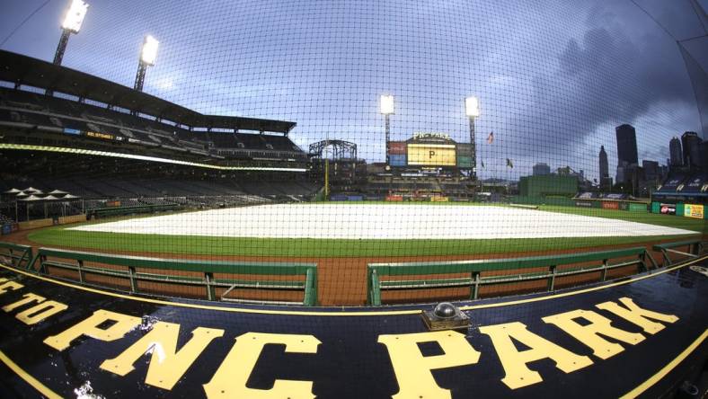 Sep 2, 2020; Pittsburgh, Pennsylvania, USA;  A rain trap covers the field as inclement weather delays the start of the game between the Chicago Cubs and the Pittsburgh Pirates at PNC Park. Mandatory Credit: Charles LeClaire-USA TODAY Sports