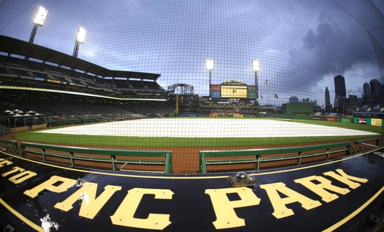 Sep 2, 2020; Pittsburgh, Pennsylvania, USA;  A rain trap covers the field as inclement weather delays the start of the game between the Chicago Cubs and the Pittsburgh Pirates at PNC Park. Mandatory Credit: Charles LeClaire-USA TODAY Sports