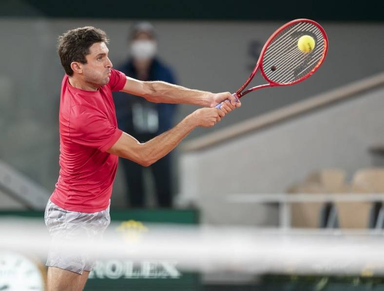 Sep 29, Paris, France; Gilles Simon (FRA) in action during his match against Denis Shapovalov (CAN) on day three at Stade Roland Garros. Mandatory Credit: Susan Mullane-USA TODAY Sports
