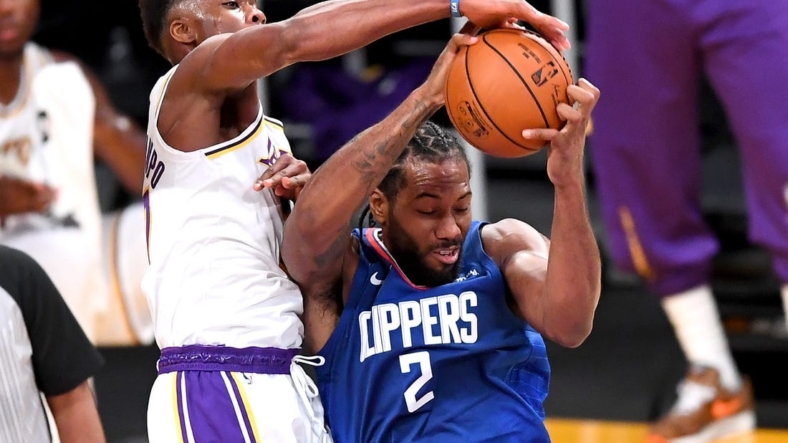 Dec 11, 2020; Los Angeles, California, USA;   Los Angeles Lakers forward Kostas Antetokounmpo (37) battles Los Angeles Clippers forward Kawhi Leonard (2) for a rebound in the first half of the game at Staples Center. Mandatory Credit: Jayne Kamin-Oncea-USA TODAY Sports