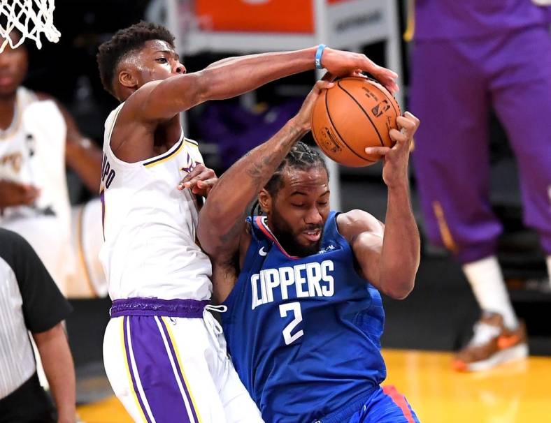 Dec 11, 2020; Los Angeles, California, USA;   Los Angeles Lakers forward Kostas Antetokounmpo (37) battles Los Angeles Clippers forward Kawhi Leonard (2) for a rebound in the first half of the game at Staples Center. Mandatory Credit: Jayne Kamin-Oncea-USA TODAY Sports