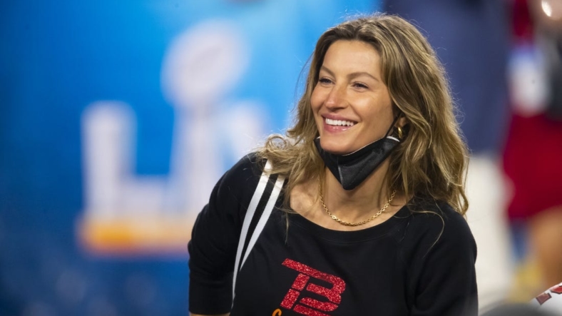 Feb 7, 2021; Tampa, FL, USA;  Gisele Bundchen , wife of Tampa Bay Buccaneers quarterback Tom Brady (not pictured) celebrates after defeating the Kansas City Chiefs in Super Bowl LV at Raymond James Stadium.  Mandatory Credit: Mark J. Rebilas-USA TODAY Sports