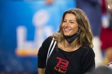 Feb 7, 2021; Tampa, FL, USA;  Gisele Bundchen , wife of Tampa Bay Buccaneers quarterback Tom Brady (not pictured) celebrates after defeating the Kansas City Chiefs in Super Bowl LV at Raymond James Stadium.  Mandatory Credit: Mark J. Rebilas-USA TODAY Sports