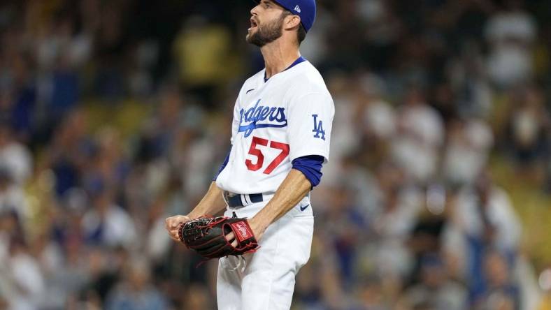 Jul 10, 2021; Los Angeles, California, USA; Los Angeles Dodgers relief pitcher Jake Reed (57) celebrates after defeating the Arizona Diamondback sat Dodger Stadium. Mandatory Credit: Kirby Lee-USA TODAY Sports