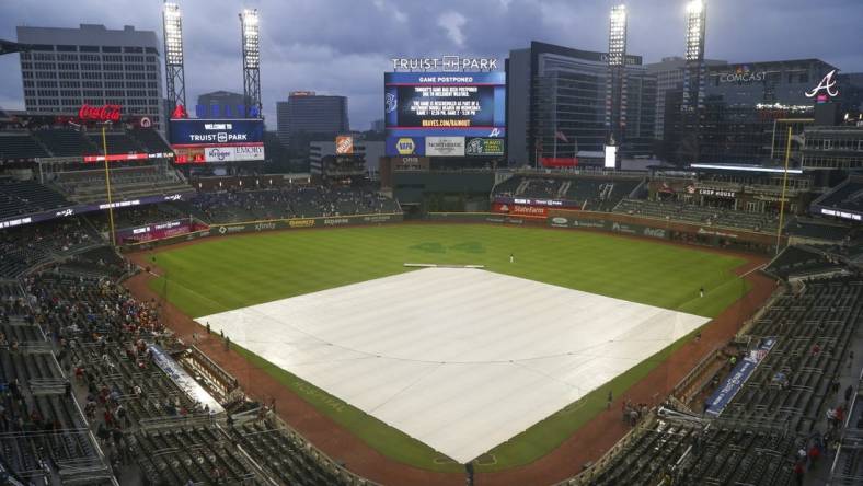 Jul 19, 2021; Atlanta, Georgia, USA; General view of the tarp on the field at Truist Park after a game was canceled between the Atlanta Braves and San Diego Padres due to rain. Mandatory Credit: Brett Davis-USA TODAY Sports