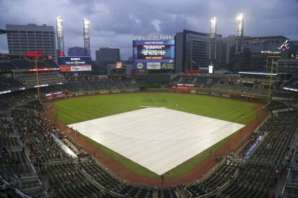 Jul 19, 2021; Atlanta, Georgia, USA; General view of the tarp on the field at Truist Park after a game was canceled between the Atlanta Braves and San Diego Padres due to rain. Mandatory Credit: Brett Davis-USA TODAY Sports