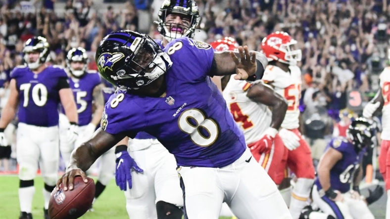 Sep 19, 2021; Baltimore, Maryland, USA;  Baltimore Ravens quarterback Lamar Jackson (8) celebrates scoring a fourth quarter touchdown  against the Kansas City Chiefs at M&T Bank Stadium. Mandatory Credit: Tommy Gilligan-USA TODAY Sports