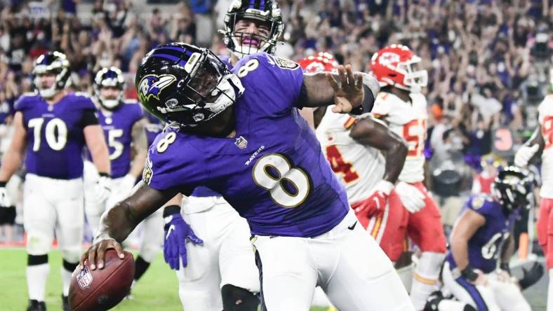 Sep 19, 2021; Baltimore, Maryland, USA;  Baltimore Ravens quarterback Lamar Jackson (8) celebrates scoring a fourth quarter touchdown  against the Kansas City Chiefs at M&T Bank Stadium. Mandatory Credit: Tommy Gilligan-USA TODAY Sports