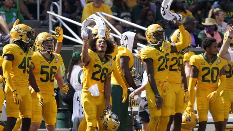 Sep 25, 2021; Waco, Texas, USA; Baylor Bears players wave their towels in the first half of the game against the Iowa State Cyclones at McLane Stadium. Mandatory Credit: Scott Wachter-USA TODAY Sports