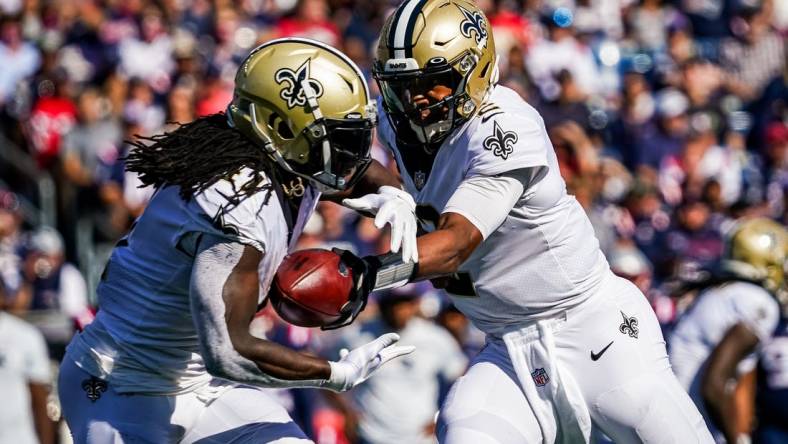 Sep 26, 2021; Foxborough, Massachusetts, USA; New Orleans Saints quarterback Jameis Winston (2) hands off the ball to running back Alvin Kamara (41) against the New England Patriots during the second half at Gillette Stadium. Mandatory Credit: David Butler II-USA TODAY Sports