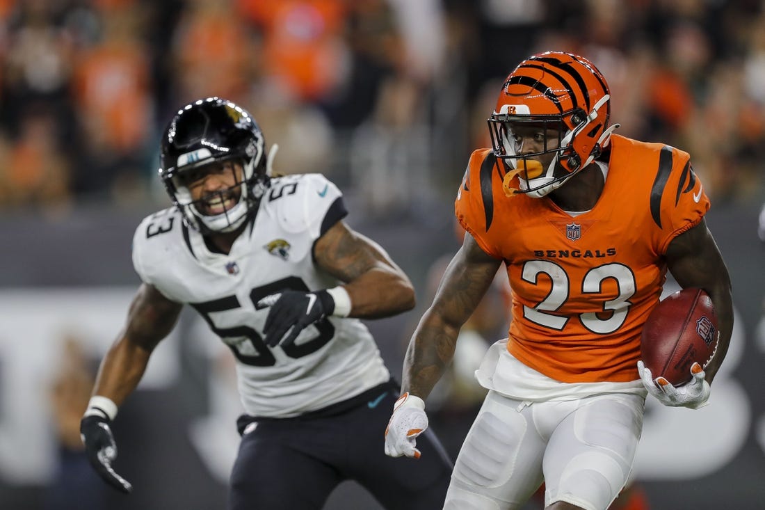 Sep 30, 2021; Cincinnati, Ohio, USA; Cincinnati Bengals cornerback Darius Phillips (23) runs with the ball past Jacksonville Jaguars linebacker Dakota Allen (53) in the first half at Paul Brown Stadium. Mandatory Credit: Katie Stratman-USA TODAY Sports