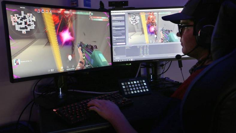 Clayton Huston watches and does play by play during the game 'Valorant' with his Hutchinson Community College esports teammates as they competed against Shelton State Community College on Thursday evening, Oct. 7, 2021.

Hut 101521 Hcc Esports 06