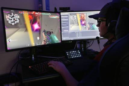 Clayton Huston watches and does play by play during the game 'Valorant' with his Hutchinson Community College esports teammates as they competed against Shelton State Community College on Thursday evening, Oct. 7, 2021.

Hut 101521 Hcc Esports 06