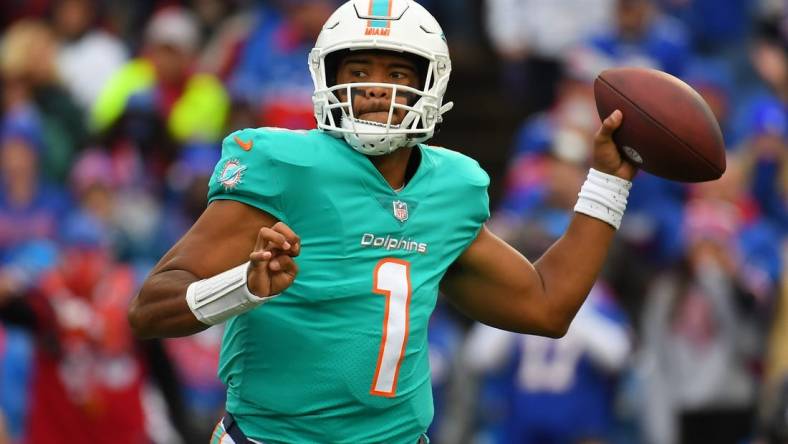 Oct 31, 2021; Orchard Park, New York, USA; Miami Dolphins quarterback Tua Tagovailoa (1) passes the ball against the Buffalo Bills during the second half at Highmark Stadium. Mandatory Credit: Rich Barnes-USA TODAY Sports