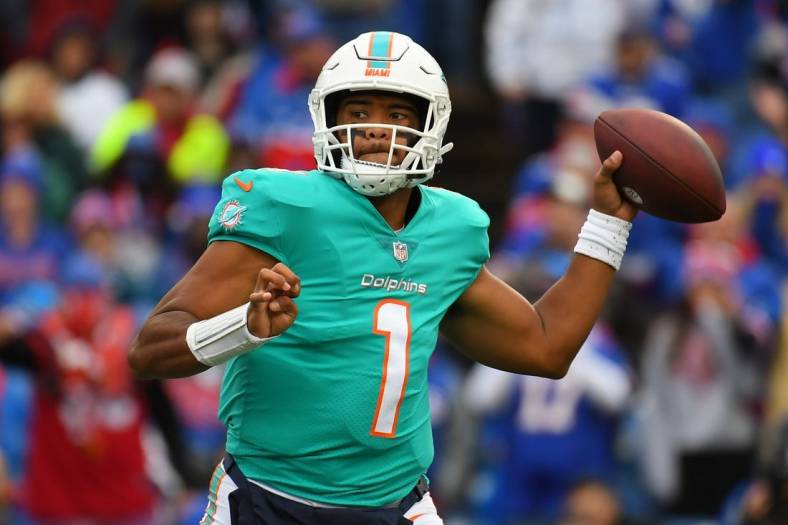Oct 31, 2021; Orchard Park, New York, USA; Miami Dolphins quarterback Tua Tagovailoa (1) passes the ball against the Buffalo Bills during the second half at Highmark Stadium. Mandatory Credit: Rich Barnes-USA TODAY Sports