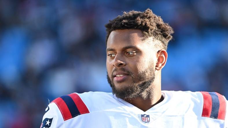 Nov 7, 2021; Charlotte, North Carolina, USA; New England Patriots offensive tackle Justin Herron (75) on the sidelines in the fourth quarter at Bank of America Stadium. Mandatory Credit: Bob Donnan-USA TODAY Sports