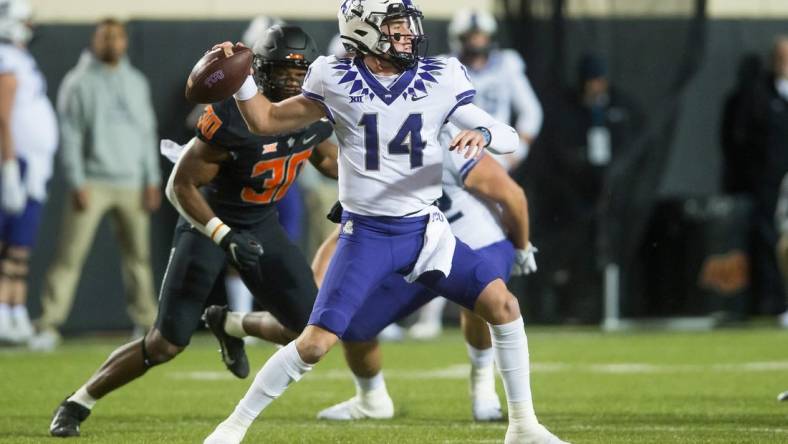 Nov 13, 2021; Stillwater, Oklahoma, USA;  TCU Horned Frogs quarterback Chandler Morris (14) throws a pass during the first quarter against the Oklahoma State Cowboys at Boone Pickens Stadium. Mandatory Credit: Brett Rojo-USA TODAY Sports