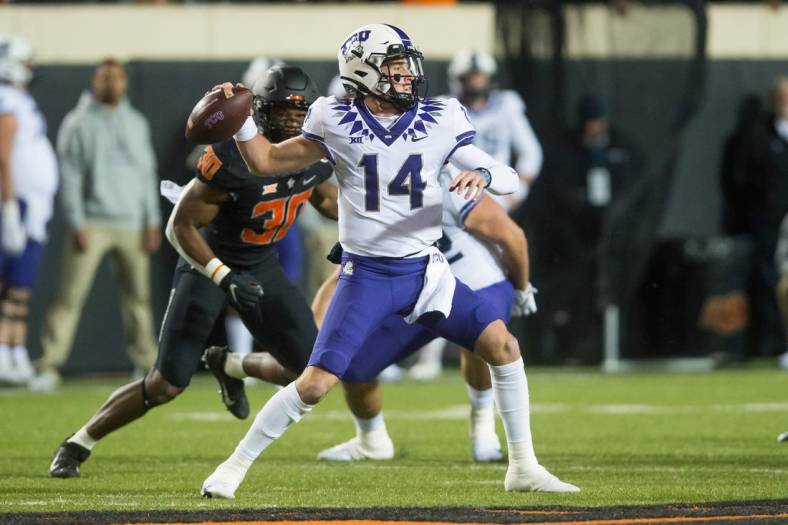 Nov 13, 2021; Stillwater, Oklahoma, USA;  TCU Horned Frogs quarterback Chandler Morris (14) throws a pass during the first quarter against the Oklahoma State Cowboys at Boone Pickens Stadium. Mandatory Credit: Brett Rojo-USA TODAY Sports