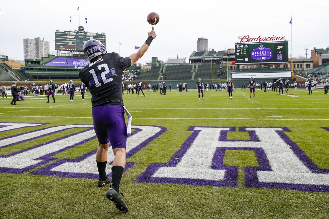 Nov 20, 2021; Chicago, Illinois, USA; Northwestern Wildcats quarterback Ryan Hilinski (12) warms up before the game between the Northwestern Wildcats and the Purdue Boilermakers at Wrigley Field. Mandatory Credit: Jon Durr-USA TODAY Sports