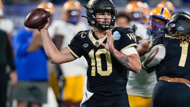 Dec 4, 2021; Charlotte, NC, USA; Wake Forest Demon Deacons quarterback Sam Hartman (10) during the first quarter in the ACC championship game at Bank of America Stadium. Mandatory Credit: Jim Dedmon-USA TODAY Sports