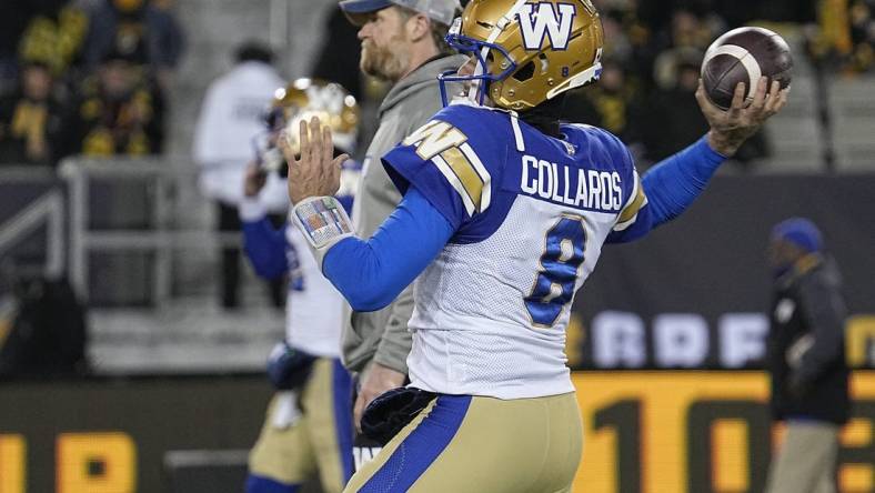 Dec 12, 2021; Hamilton, Ontario, CAN; Winnipeg Blue Bombers quarterback Zach Collaros (8) and head coach Mike O'Shea during warmup for the 108th Grey Cup football game against the Hamilton Tiger-Cats at Tim Hortons Field. Mandatory Credit: John E. Sokolowski-USA TODAY Sports