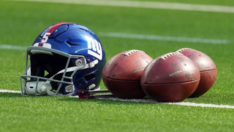 Dec 12, 2021; Inglewood, California, USA; A detailed view of  a New York Giants helmet and Wilson official NFL Due footballs at SoFi Stadium. Mandatory Credit: Kirby Lee-USA TODAY Sports