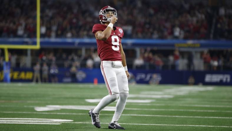 Dec 31, 2021; Arlington, Texas, USA; Alabama Crimson Tide quarterback Bryce Young (9) reacts after throwing a touchdown in the fourth quarter against the Cincinnati Bearcats during the 2021 Cotton Bowl college football CFP national semifinal game at AT&T Stadium. Mandatory Credit: Tim Heitman-USA TODAY Sports