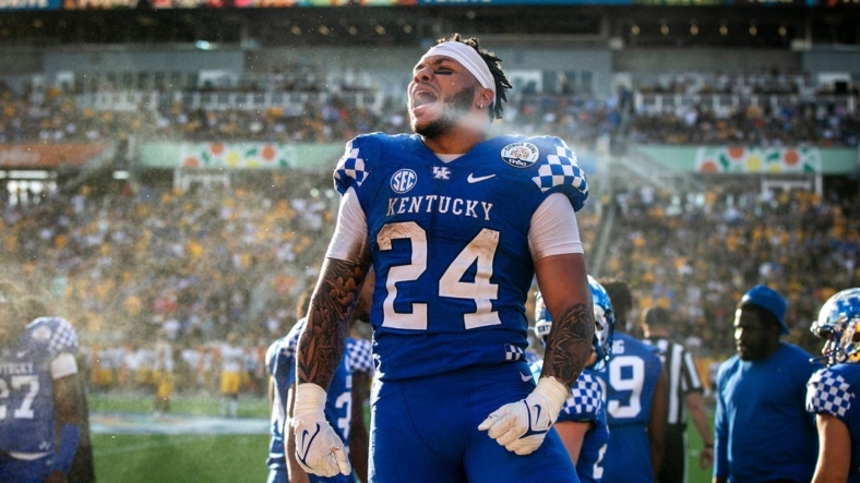 Kentucky running back Chris Rodriguez, Jr. (24) pumps up the crowd after scoring a touchdown a NCAA college football game in the Vrbo Citrus Bowl against Iowa, Saturday, Jan. 1, 2022, at Camping World Stadium in Orlando, Fla.211231 Iowa Kentucky Citrus Fb 008 JpgSyndication Hawkcentral