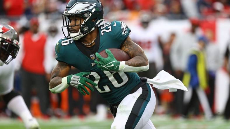 Jan 16, 2022; Tampa, Florida, USA; Philadelphia Eagles running back Miles Sanders (26) runs with the ball against the Tampa Bay Buccaneers during the second half in a NFC Wild Card playoff football game at Raymond James Stadium. Mandatory Credit: Kim Klement-USA TODAY Sports