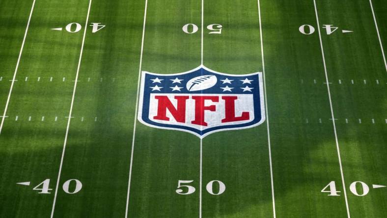 Feb 1, 2022; Inglewood, CA, USA; The NFL shield logo is seen at midfield at SoFi Stadium. Super Bowl LVI between the Los Angeles Rams and the Cincinnati Bengals will be played on Feb. 13, 2022. Mandatory Credit: Kirby Lee-USA TODAY Sports