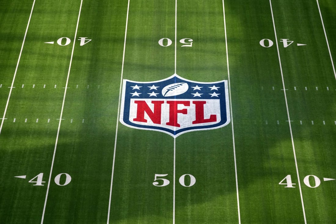 Feb 1, 2022; Inglewood, CA, USA; The NFL shield logo is seen at midfield at SoFi Stadium. Super Bowl LVI between the Los Angeles Rams and the Cincinnati Bengals will be played on Feb. 13, 2022. Mandatory Credit: Kirby Lee-USA TODAY Sports