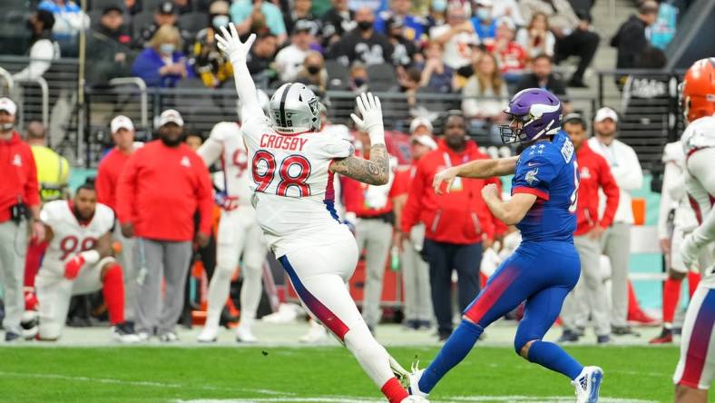 Feb 6, 2022; Paradise, Nevada, USA; AFC defensive end Maxx Crosby of the Las Vegas Raiders (98) pressures NFC quarterback Kirk Cousins of the Minnesota Vikings (8) during the Pro Bowl football game at Allegiant Stadium. Mandatory Credit: Stephen R. Sylvanie-USA TODAY Sports