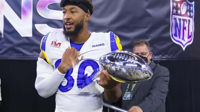 Feb 13, 2022; Inglewood, CA, USA; Los Angeles Rams tight end Kendall Blanton celebrates with the Vince Lombardi Trophy after defeating the Cincinnati Bengals during Super Bowl LVI at SoFi Stadium. Mandatory Credit: Mark J. Rebilas-USA TODAY Sports