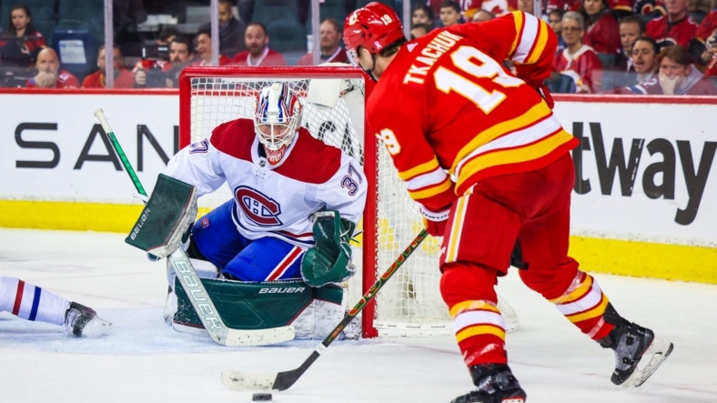 Mar 3, 2022; Calgary, Alberta, CAN; Montreal Canadiens goaltender Andrew Hammond (37) guards his net as Calgary Flames left wing Matthew Tkachuk (19) tries to score during the third period at Scotiabank Saddledome. Mandatory Credit: Sergei Belski-USA TODAY Sports