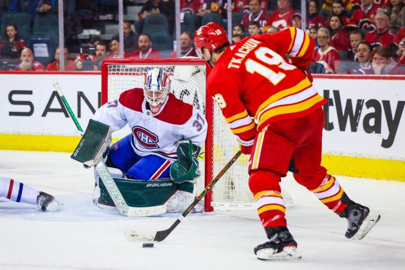 Mar 3, 2022; Calgary, Alberta, CAN; Montreal Canadiens goaltender Andrew Hammond (37) guards his net as Calgary Flames left wing Matthew Tkachuk (19) tries to score during the third period at Scotiabank Saddledome. Mandatory Credit: Sergei Belski-USA TODAY Sports
