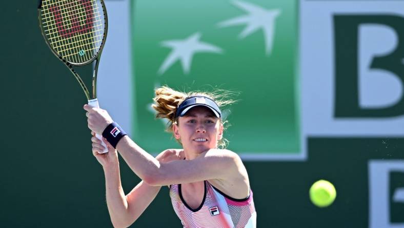 Mar 11, 2022; Indian Wells, CA, USA; Ekaterina Alexandrova (RUS) hits a shot in her 2nd round match against Simona Halep (ROU) at the BNP Paribas Open at the Indian Wells Tennis Garden. Mandatory Credit: Jayne Kamin-Oncea-USA TODAY Sports