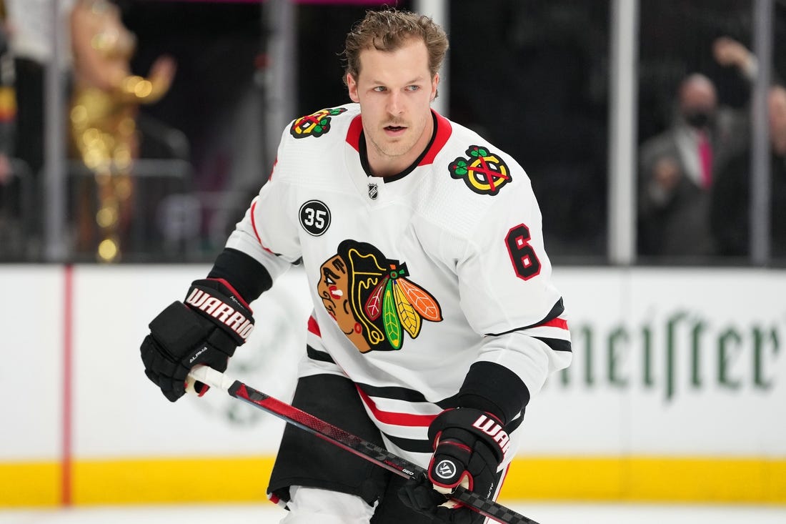 Mar 26, 2022; Las Vegas, Nevada, USA; Chicago Blackhawks defenseman Jake McCabe (6) warms up before a game against the Vegas Golden Knights at T-Mobile Arena. Mandatory Credit: Stephen R. Sylvanie-USA TODAY Sports