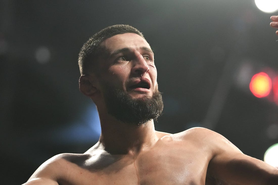 Apr 9, 2022; Jacksonville, Florida, USA;  Khamzat Chimaev (blue gloves) after a fight against Gilbert Burns (red gloves) during UFC 273 at VyStar Veterans Memorial Arena. Mandatory Credit: David Yeazell-USA TODAY Sports